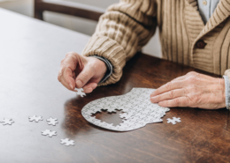 Senior in Assisted Living Doing a Puzzle