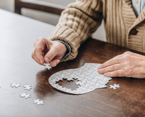 Senior in Assisted Living Doing a Puzzle