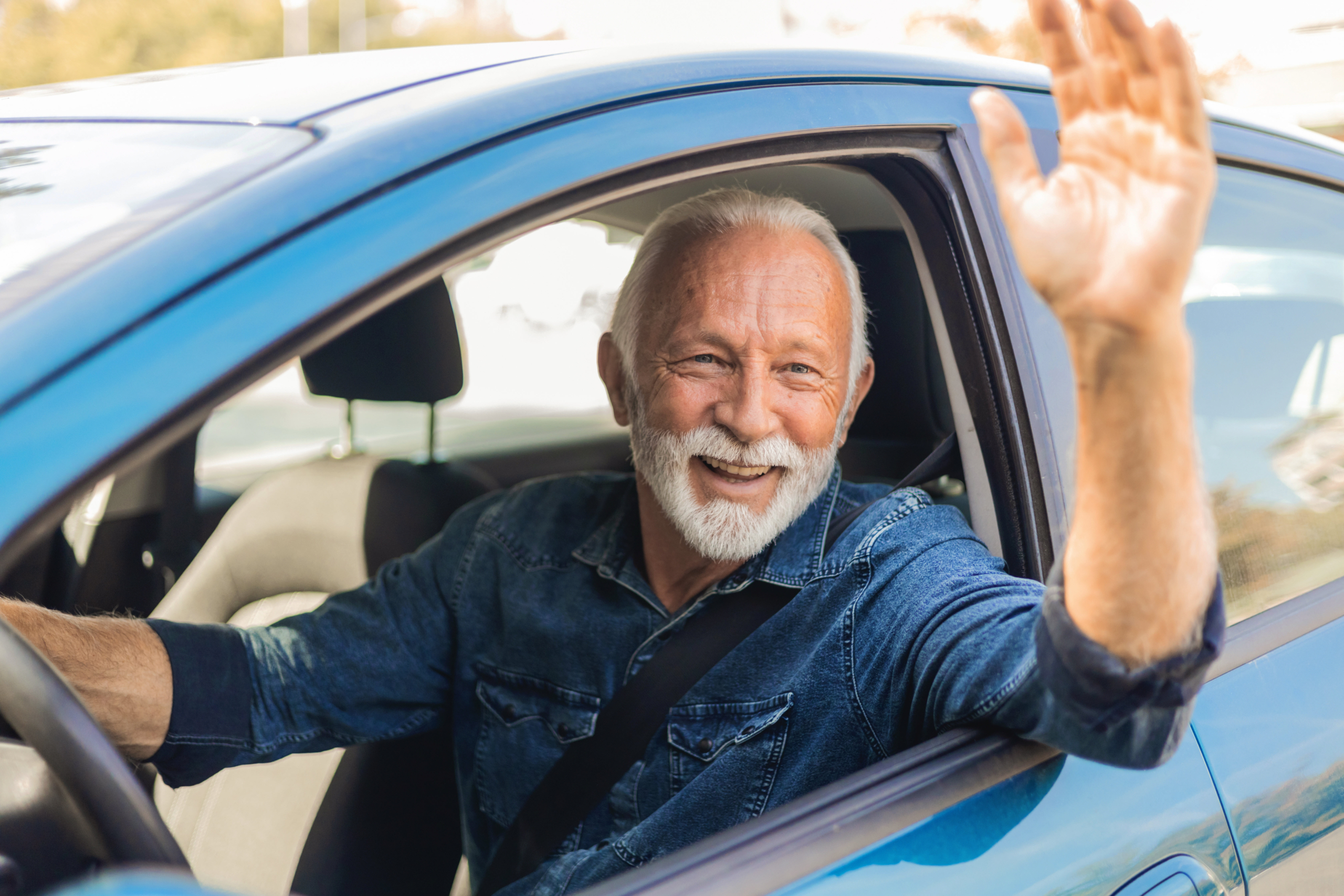 Senior in Drivers Seat of Car