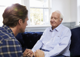 Son Speaking with Senior Parent